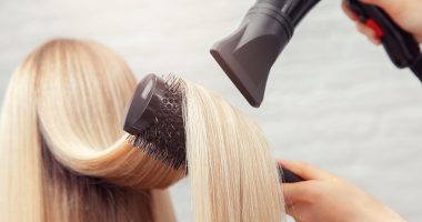 Close-up of hair dryer, concept cut salon, female stylist.